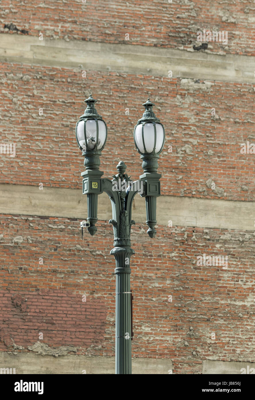 Street lamp in front of brick wall Stock Photo - Alamy