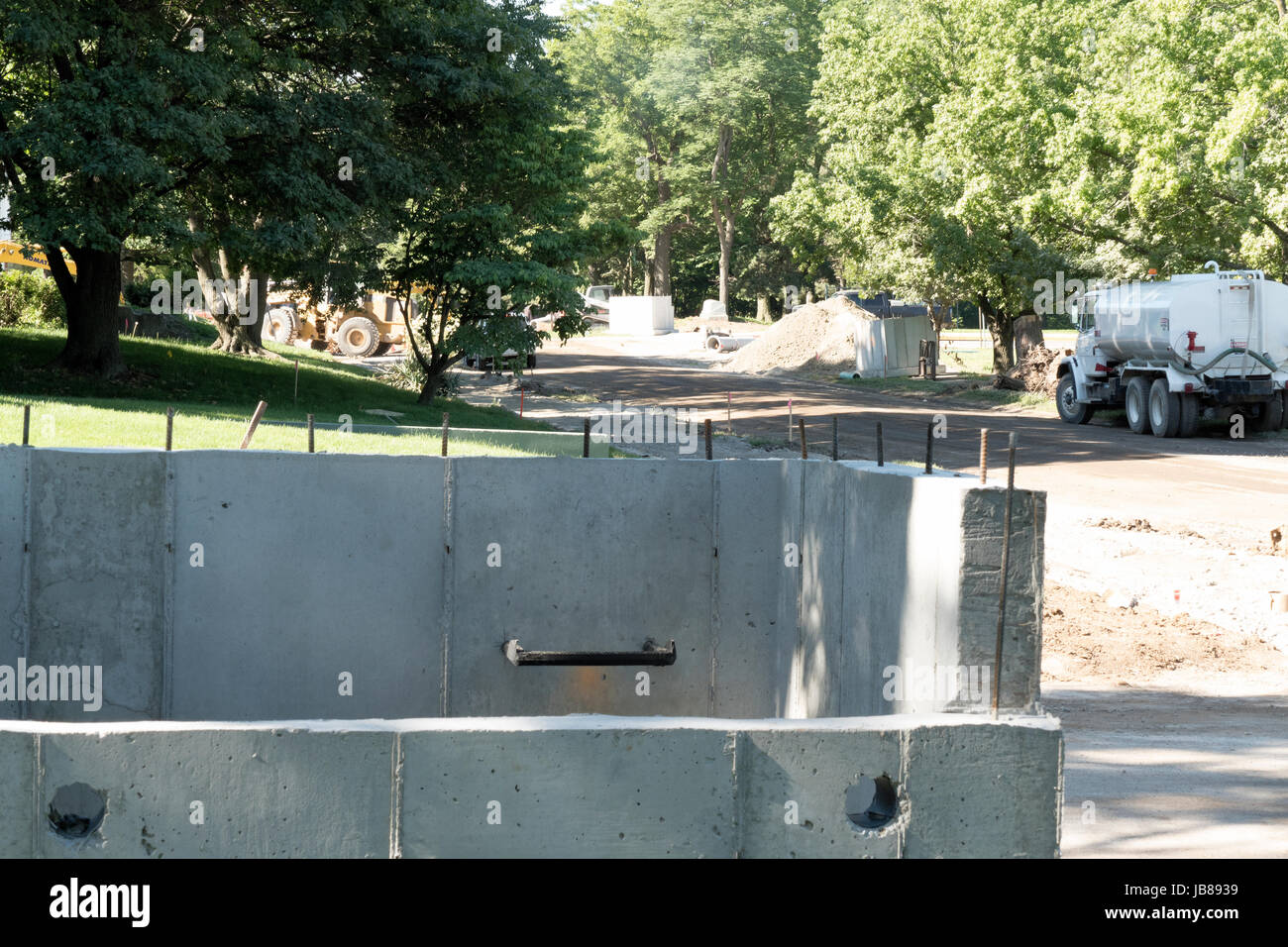 Road Construction Catch Basin With Water Tanker In Background Stock