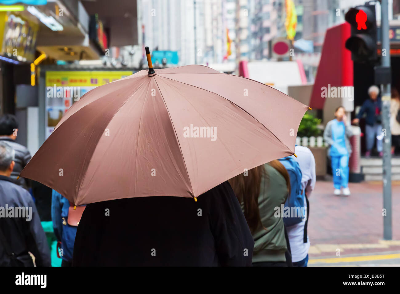 person with rain umbrella walking in the rainy city Stock Photo - Alamy