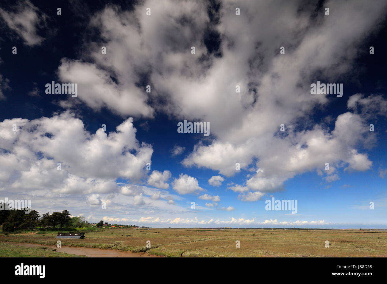 A view across the marshes looking to Brancaster Staithe from Burnham Deepdale on the North Norfolk coast. Stock Photo