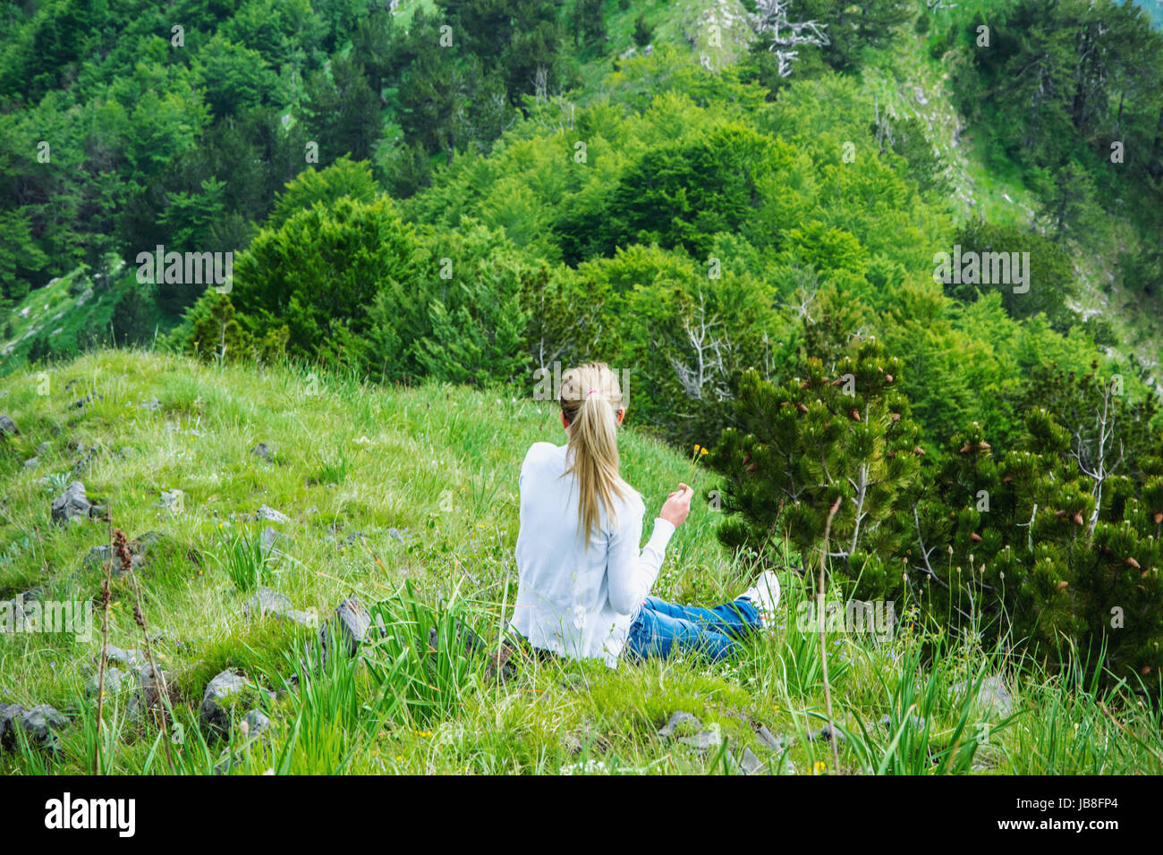 Girl Sitting On High Hill High Resolution Stock Photography and Images ...