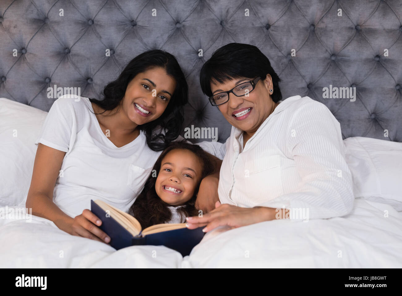 Indian girl reading book bed hi-res stock photography and images - Alamy