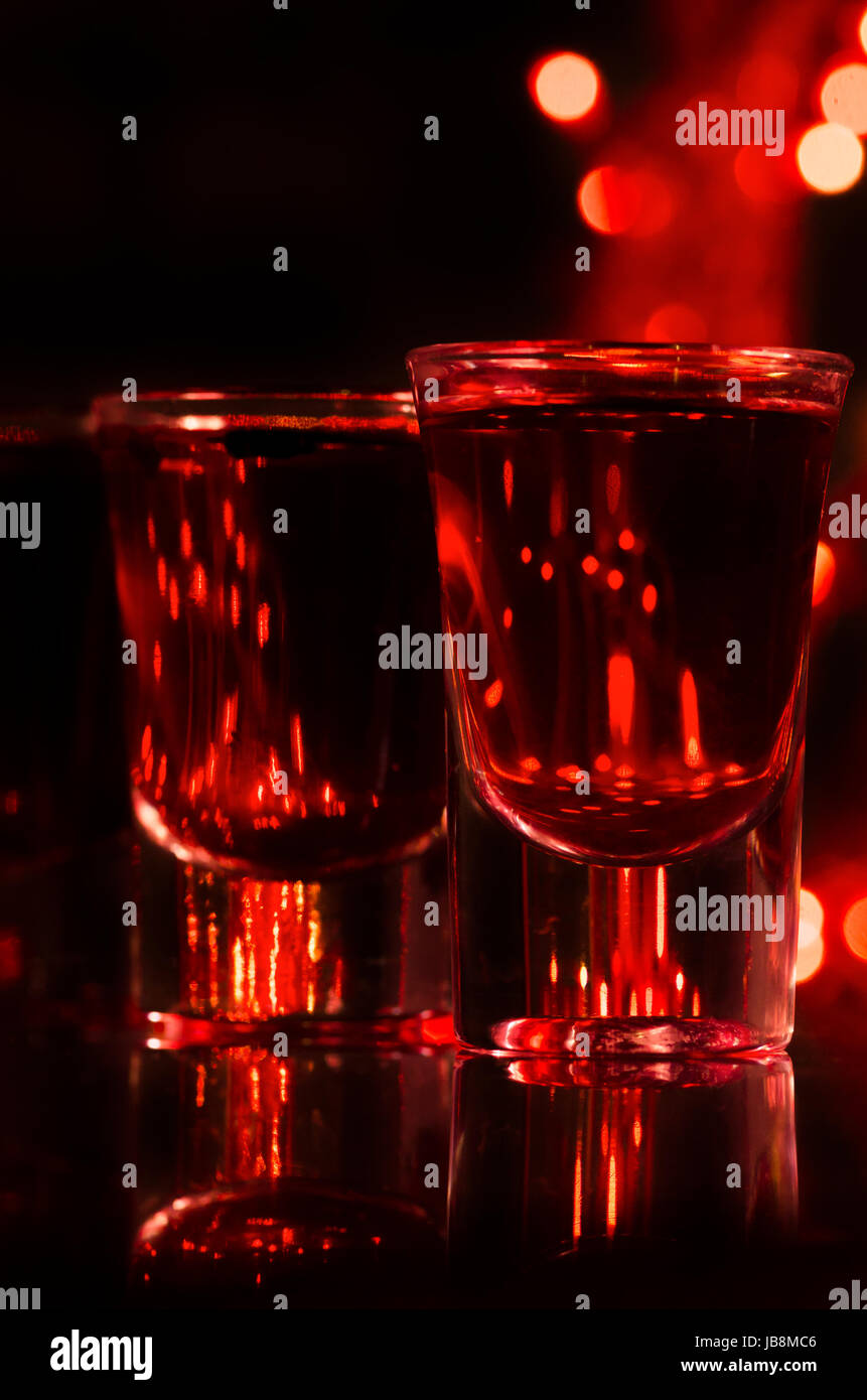 Red cocktail in shot glasses Stock Photo