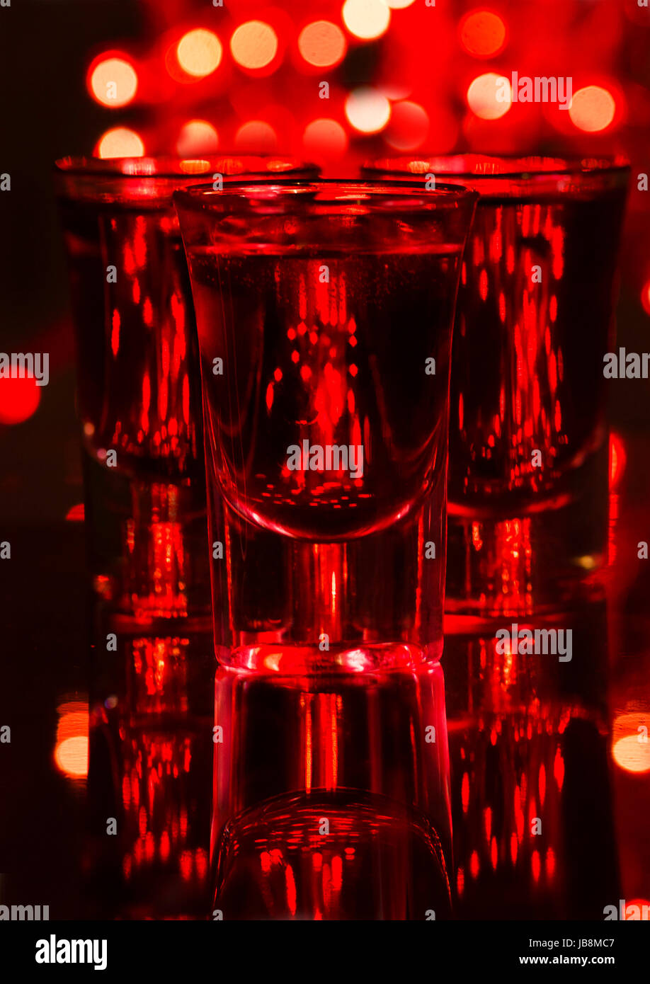 Red cocktail in shot glasses Stock Photo