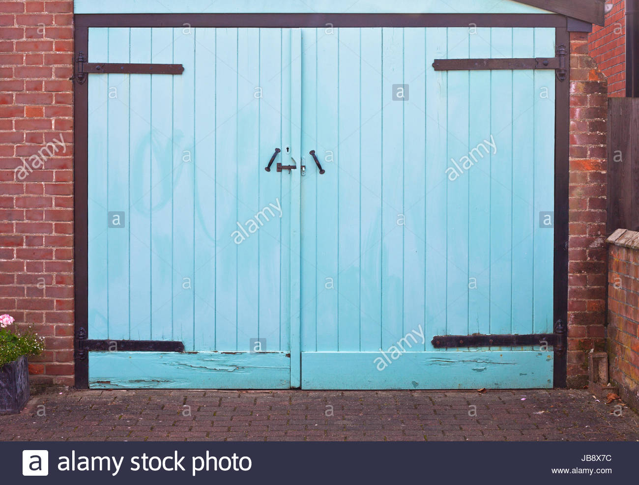 A Vibrant Blue Garage Door As A Background Image Stock Photo