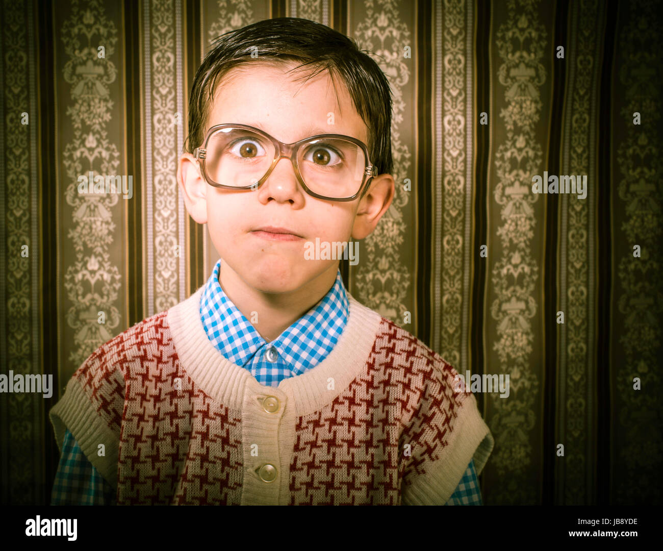 Smiling child with glasses in vintage clothes. Close up shot Stock