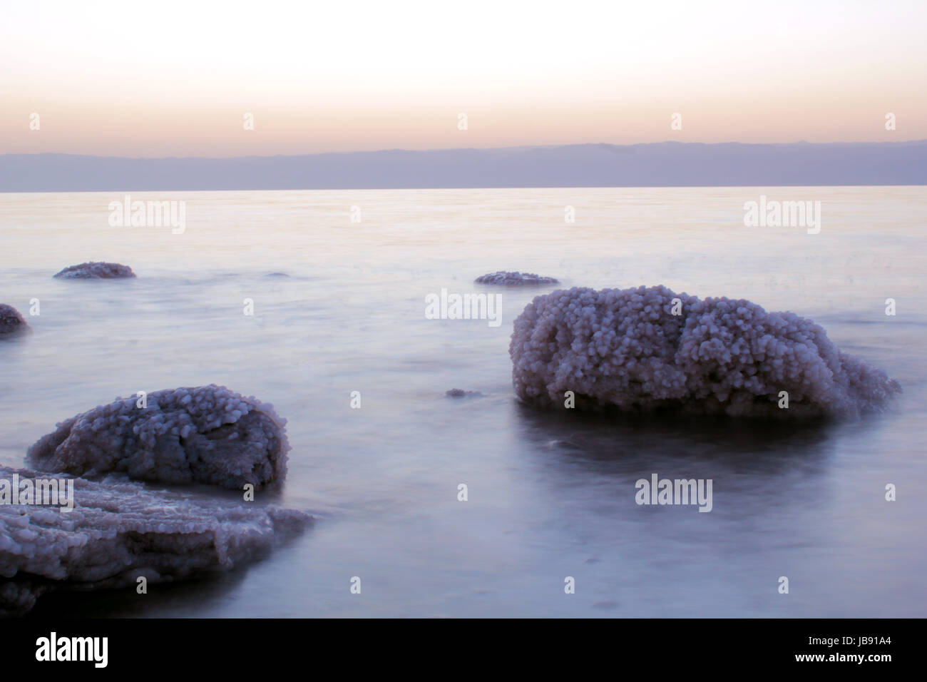 Dead Sea coastline, whit salt crystals and formations in the rocks. Jordan Stock Photo