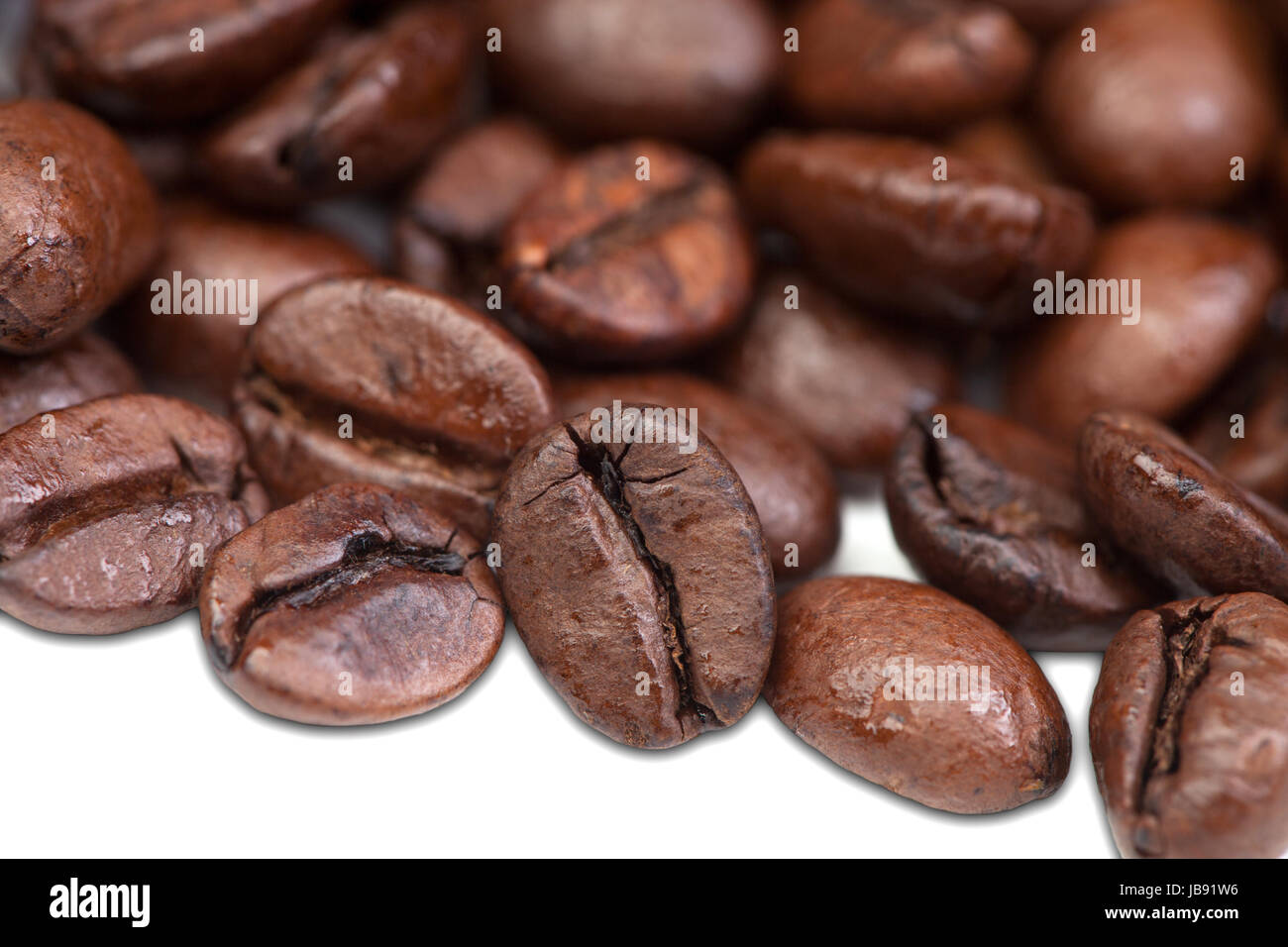Roasted coffee beans isolated on white background Stock Photo - Alamy