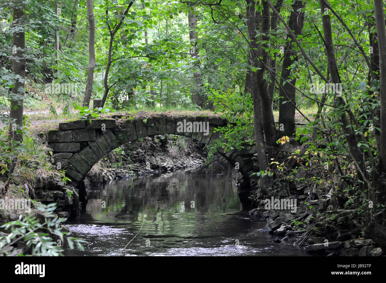 old stone bridge over creek Stock Photo Alamy