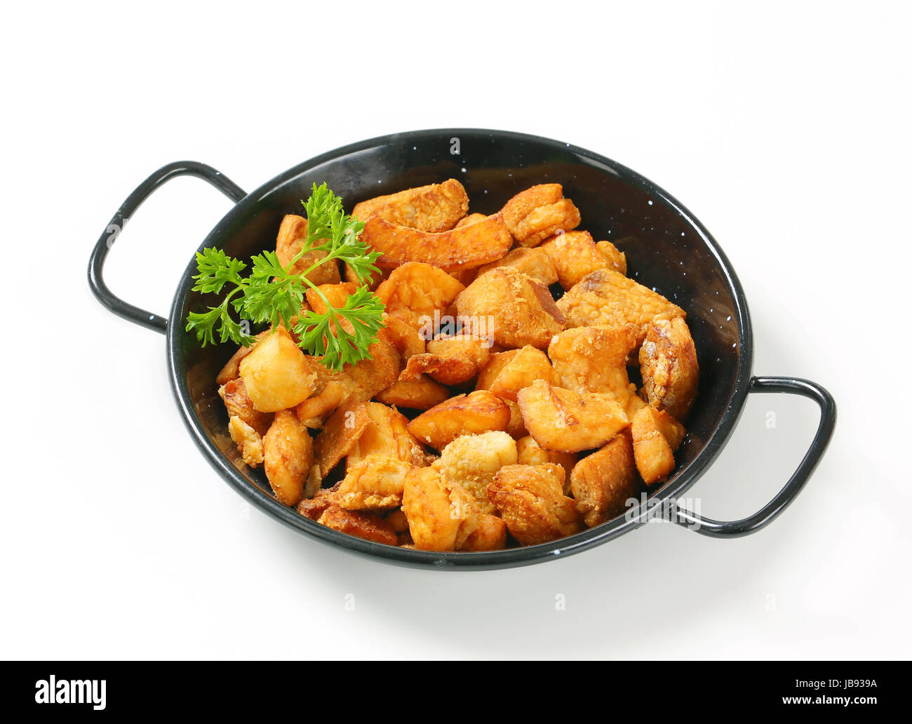 Crispy fried pork greaves in a skillet Stock Photo - Alamy