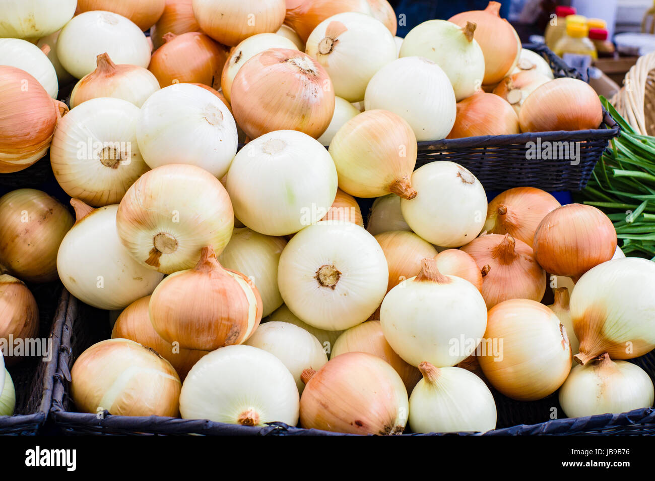 Fresh onions on display at the farmers market Stock Photo