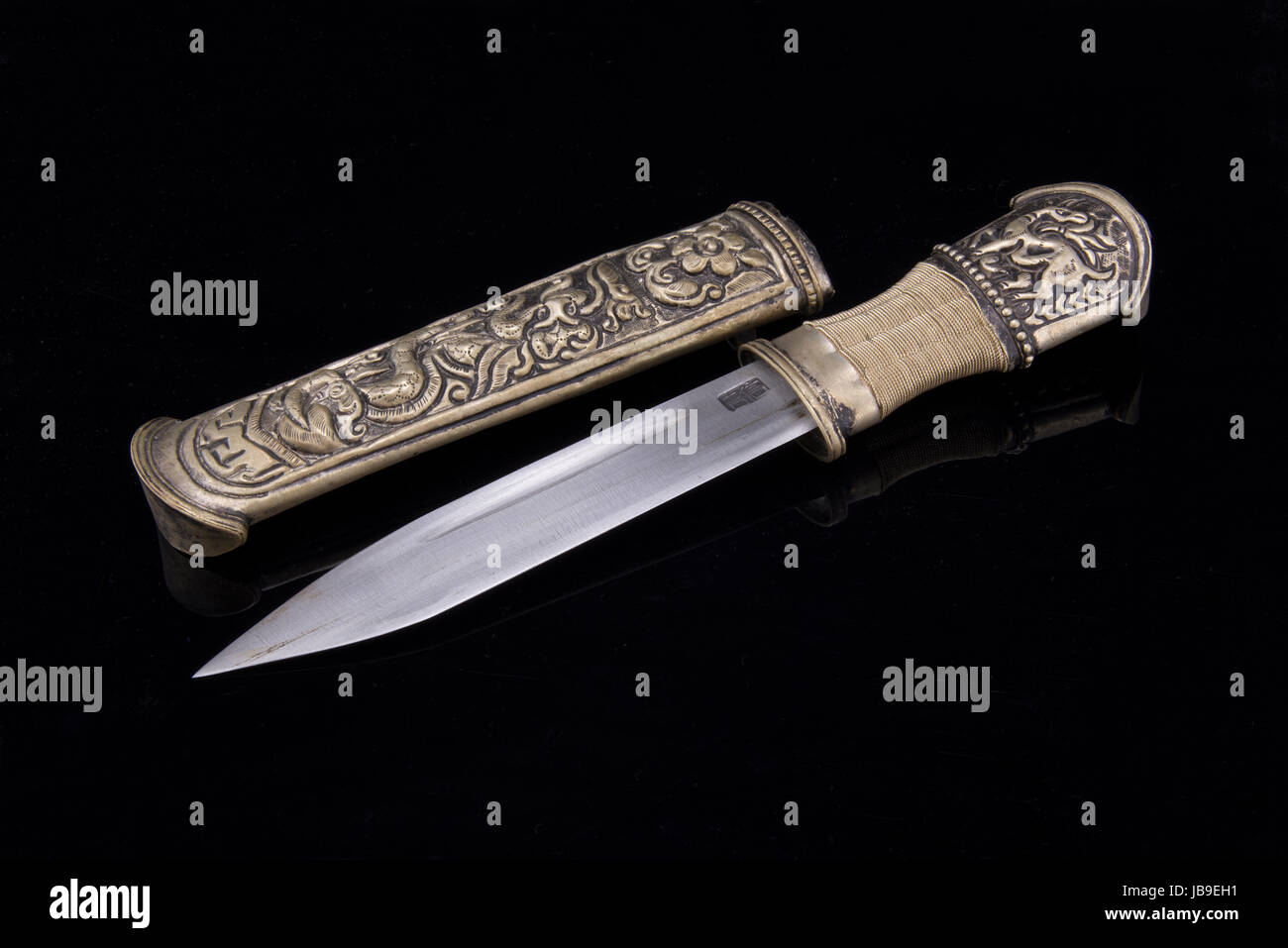 beautifully carved Tibetan knives, in the black background Stock Photo