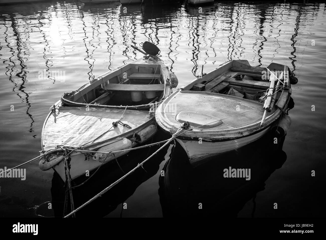 Row boats dock sunset Black and White Stock Photos & Images - Alamy
