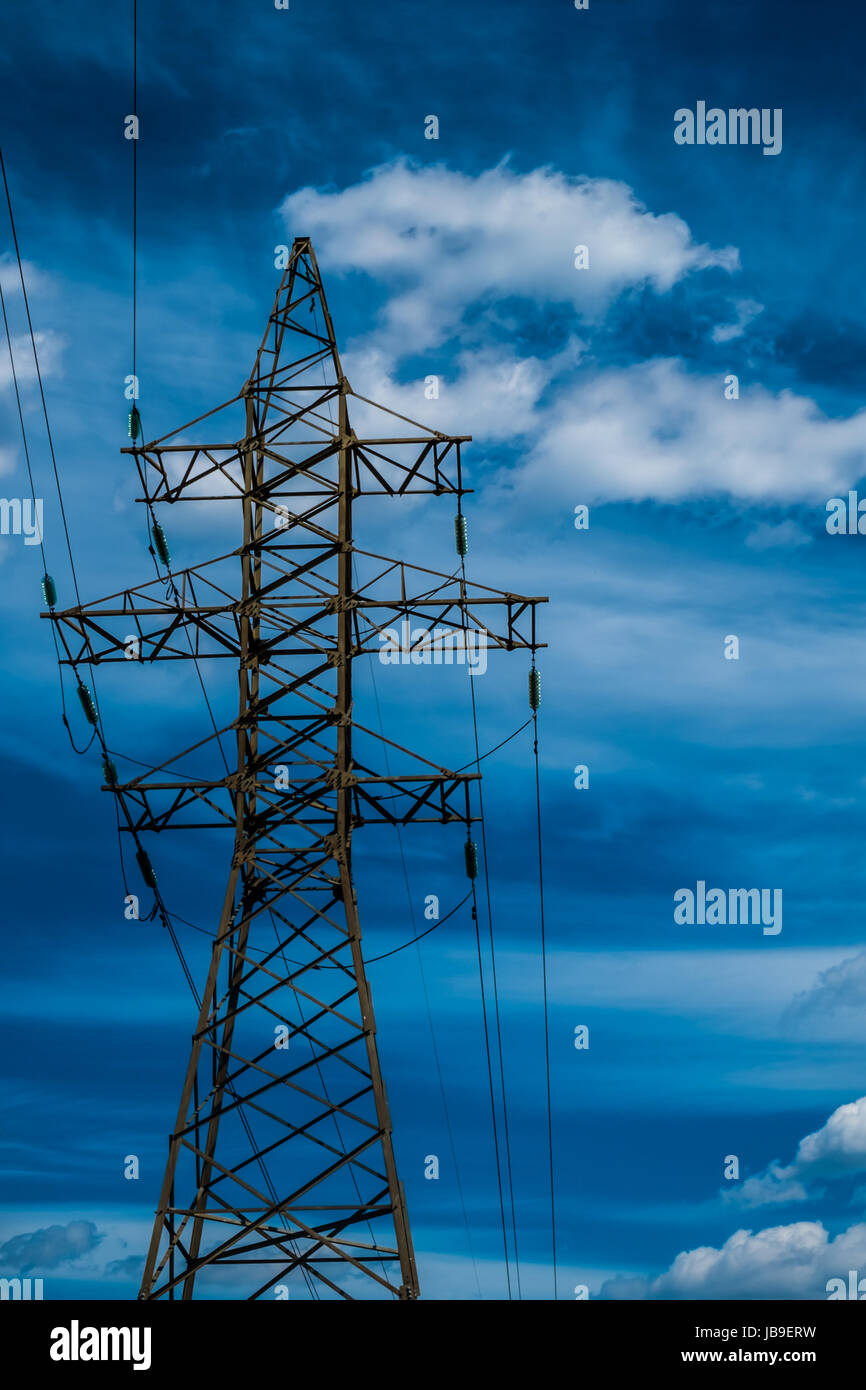 High voltage power line tower with blue sky on backgound Stock Photo ...
