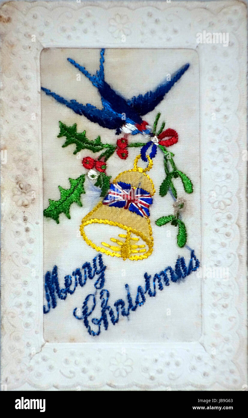 Embroidered silk Christmas card with Merry Christmas greetings from the First World War, hand-embroidered in coloured thread Stock Photo