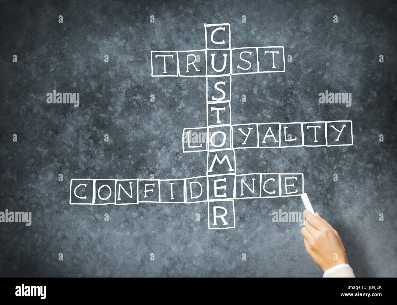 Woman draw crossword Stock Photo Alamy