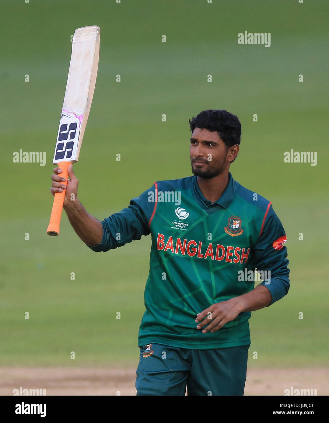 Bangladesh's Mahmudullah raises his bat after reaching his century ...