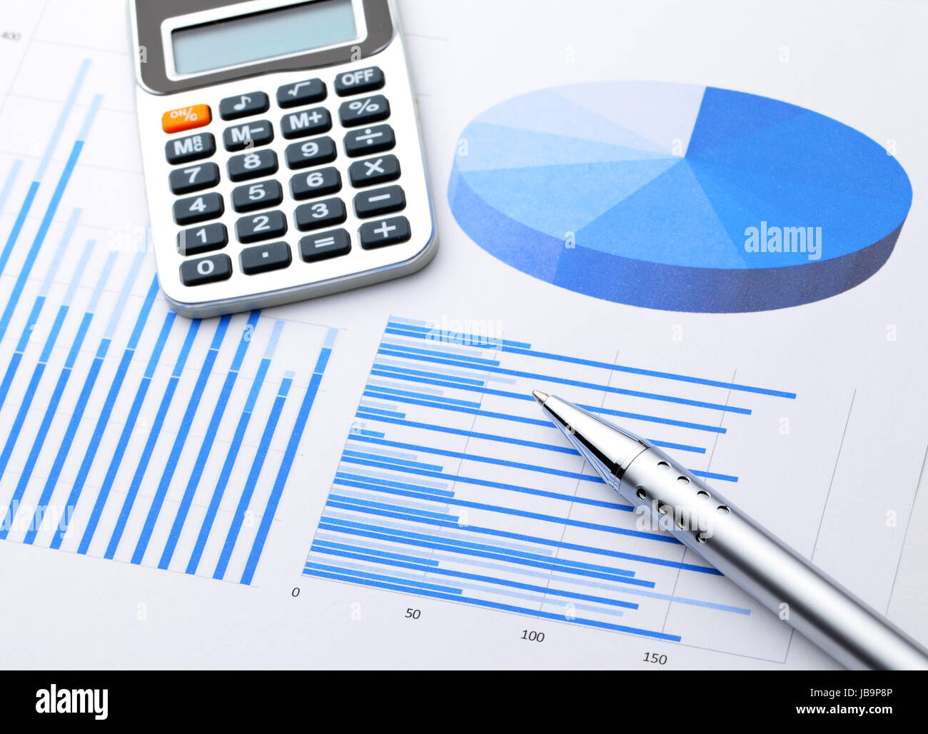 Graphical chart with pen and calcultor Stock Photo - Alamy