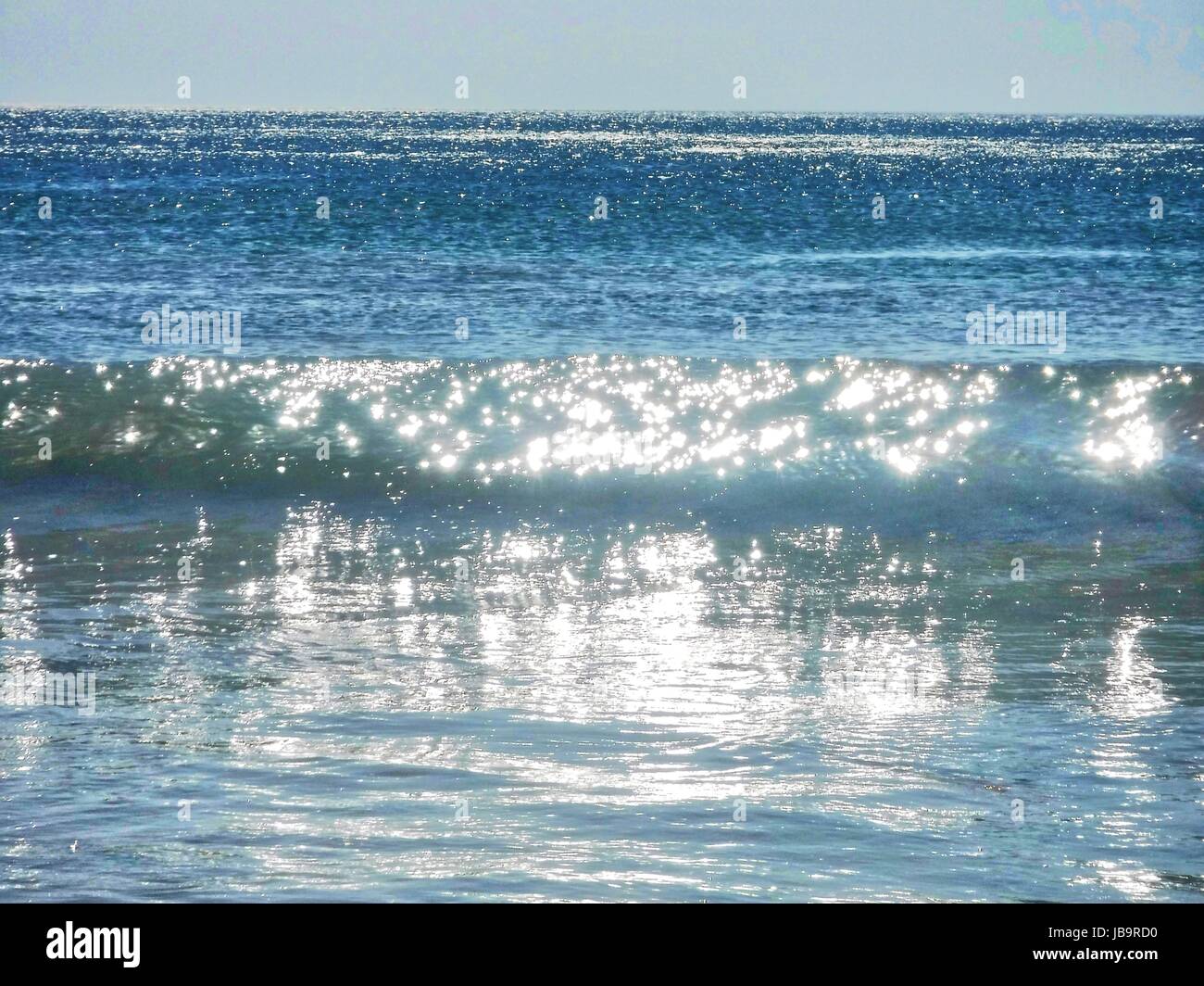 Sparkling Sunlight On Blue Ocean Water And Waves Stock Photo Alamy