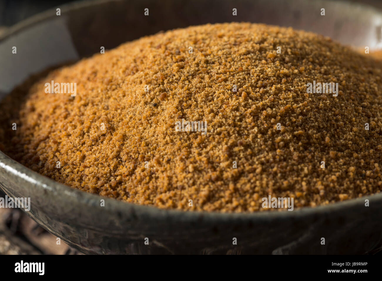 Raw Organic Coconut Palm Sugar in a Bowl Stock Photo