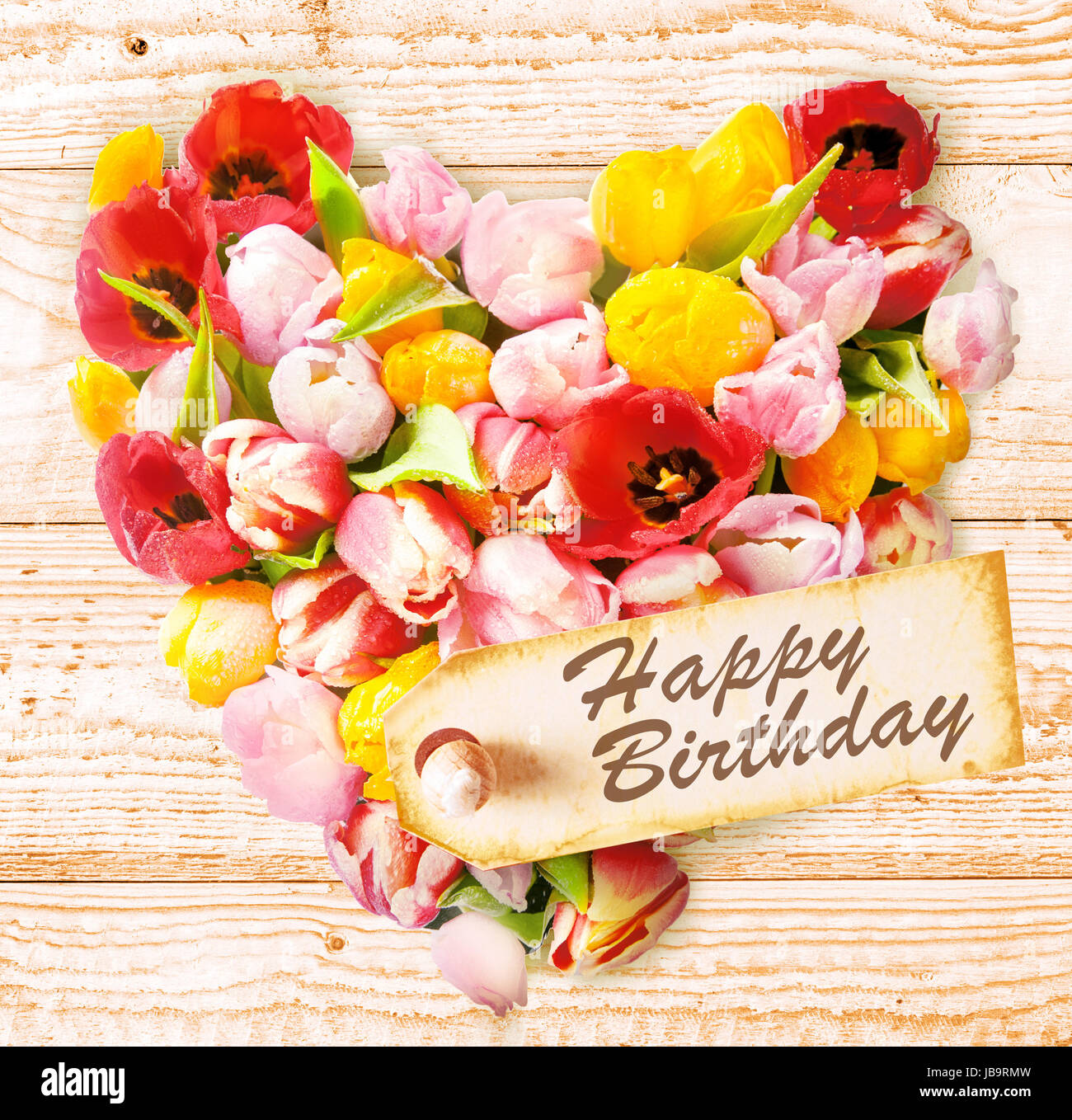 Sentimental floral heart birthday greeting with a sym…