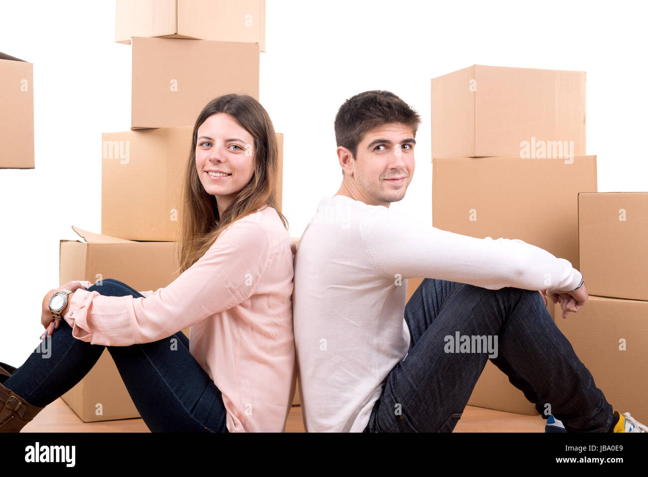 Happy couple with boxes moving into new home apartment Stock Photo - Alamy