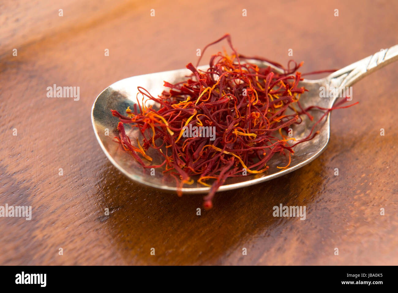 stigmas of saffron in spoon Stock Photo Alamy