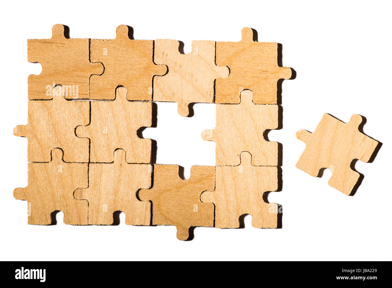 Wooden puzzle on white background. White isolated Stock Photo - Alamy
