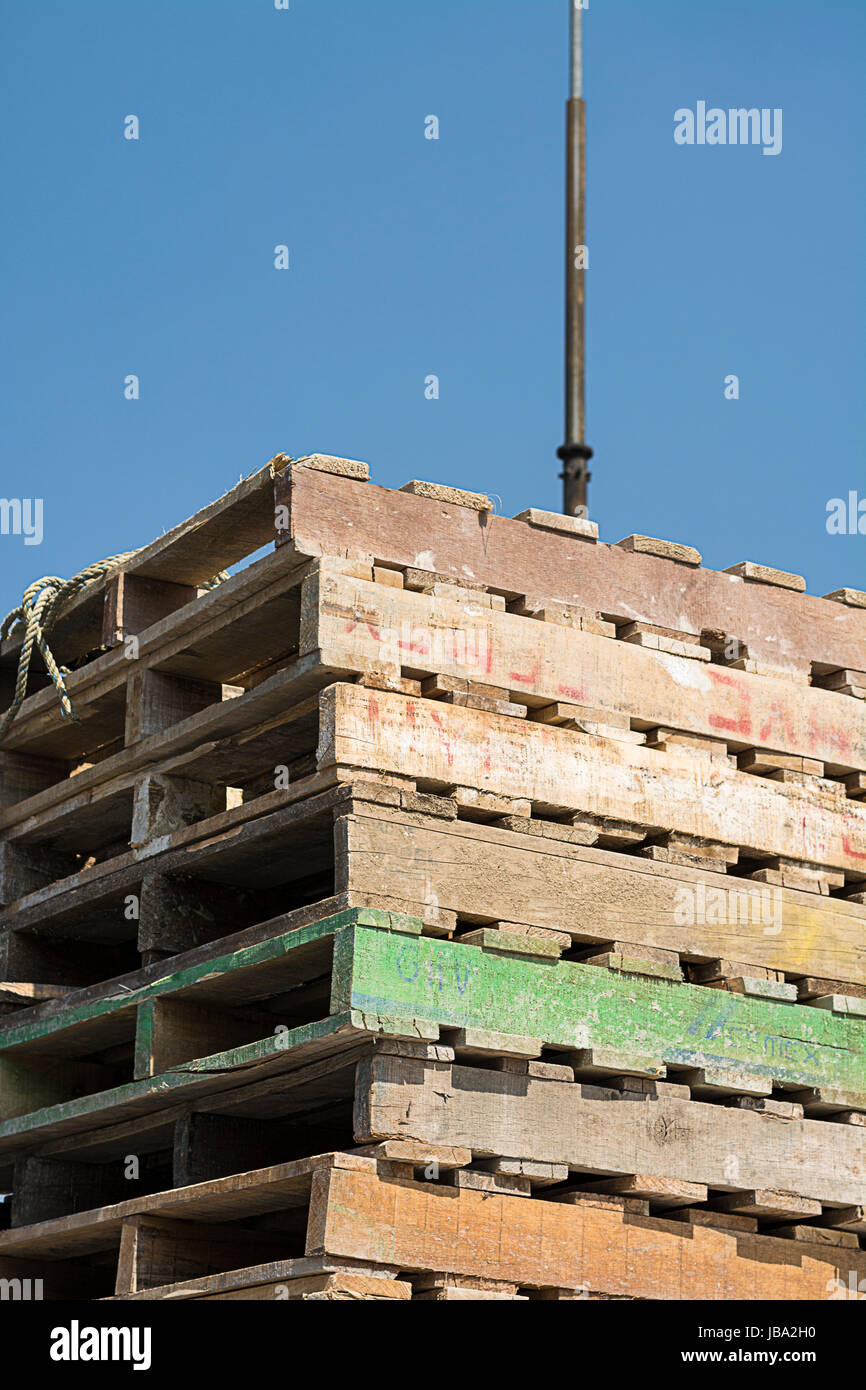 Construction wooden pallets transported on a flatbed truck load Stock