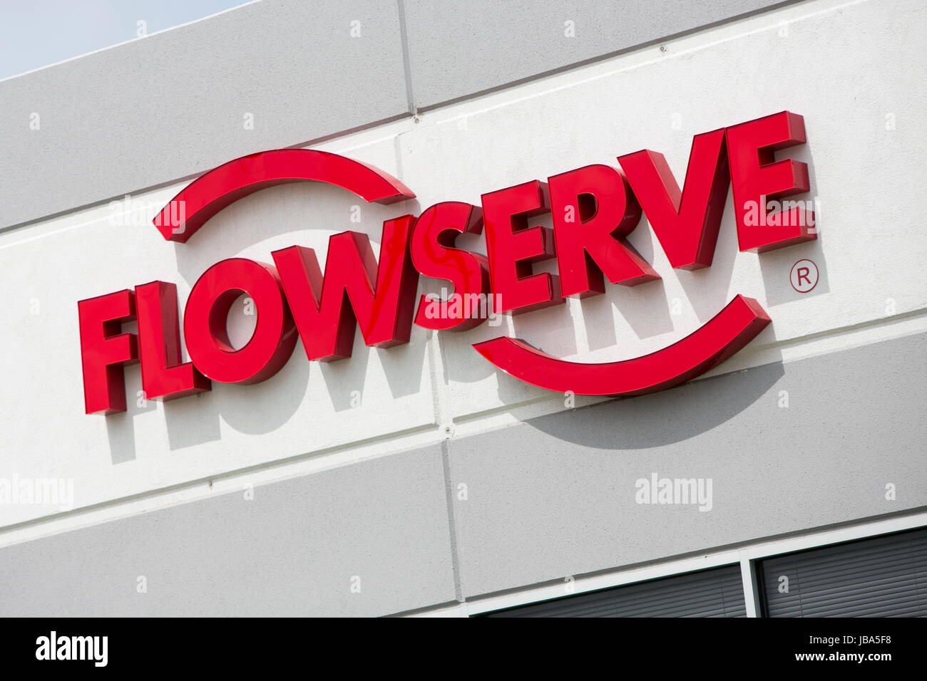 A logo sign outside of a facility occupied by the Flowserve Corporation