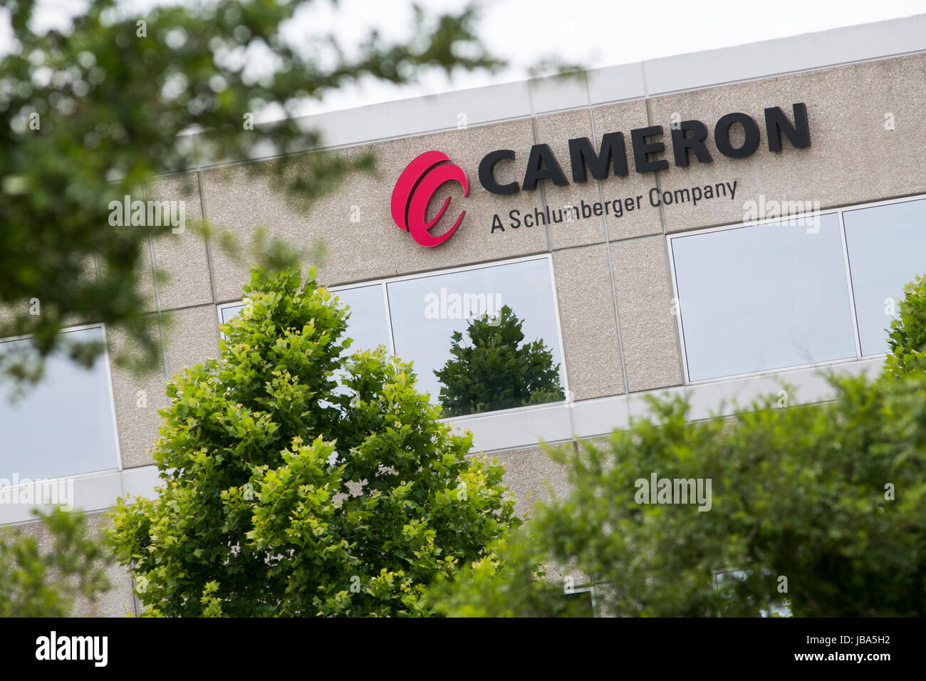 A logo sign outside of a facility occupied by the Cameron International
