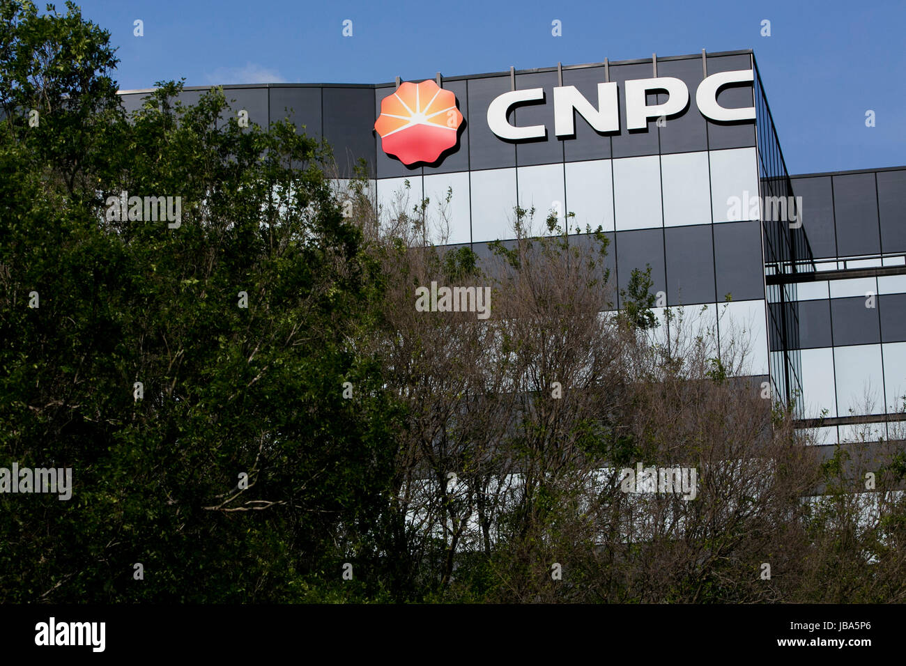 A logo sign outside of a facility occupied by the China National Petroleum Corporation (CNPC) in Houston, Texas, on May 27, 2017. Stock Photo