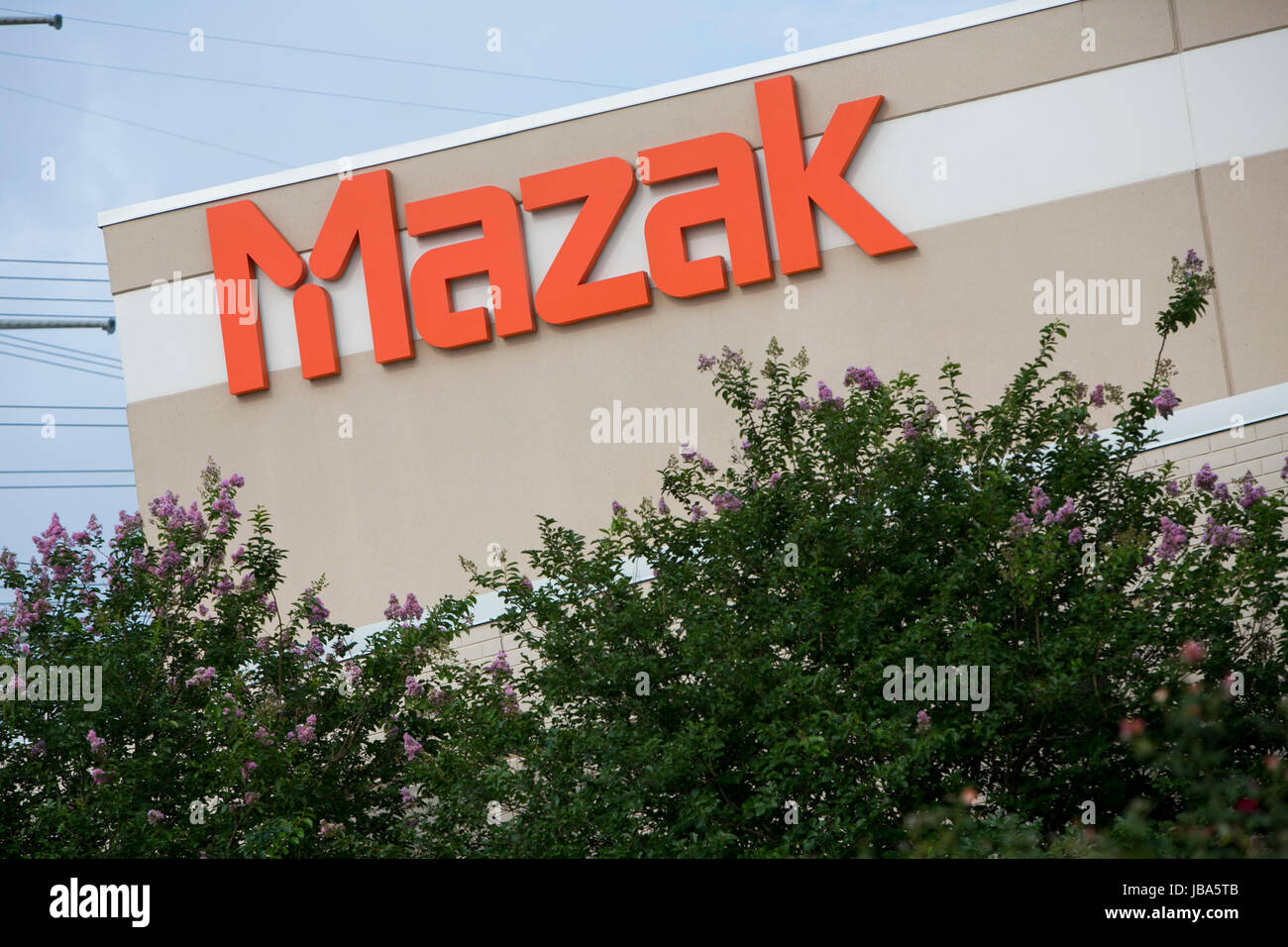 A logo sign outside of a facility occupied by Yamazaki Mazak