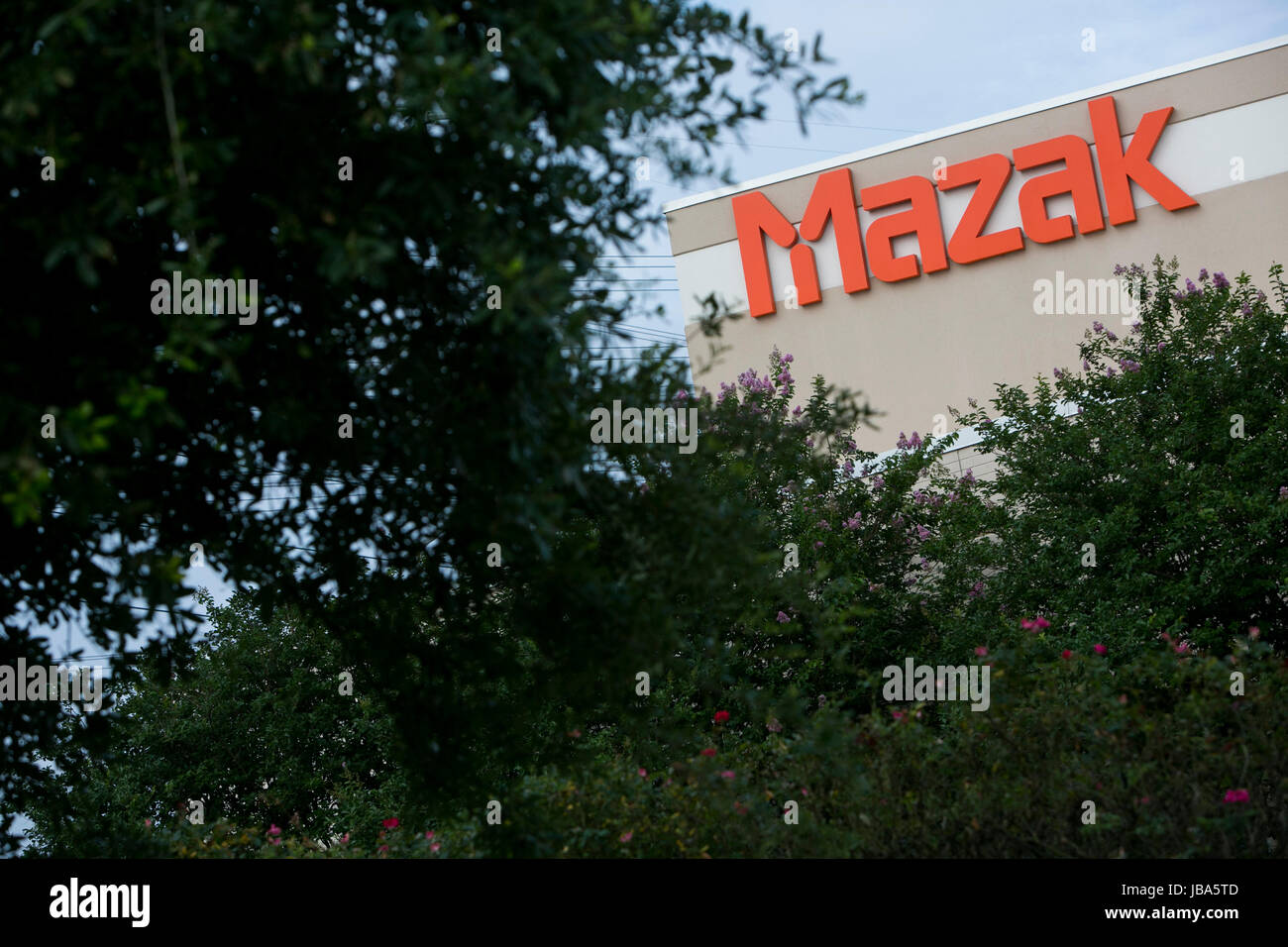 A logo sign outside of a facility occupied by Yamazaki Mazak