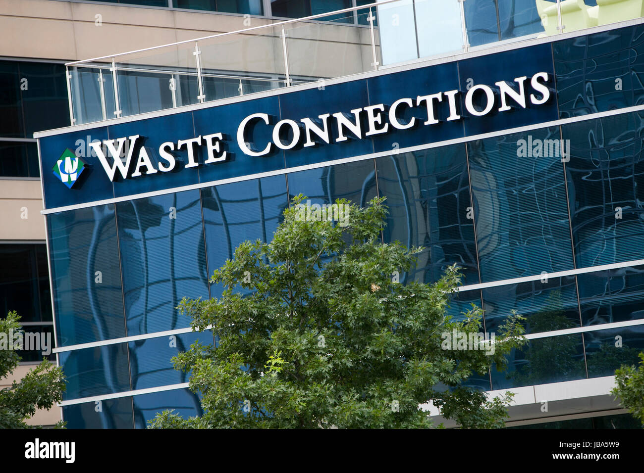 A logo sign outside of a facility occupied by Waste Connections, Inc., in The Woodlands, Texas, on May 28, 2017. Stock Photo