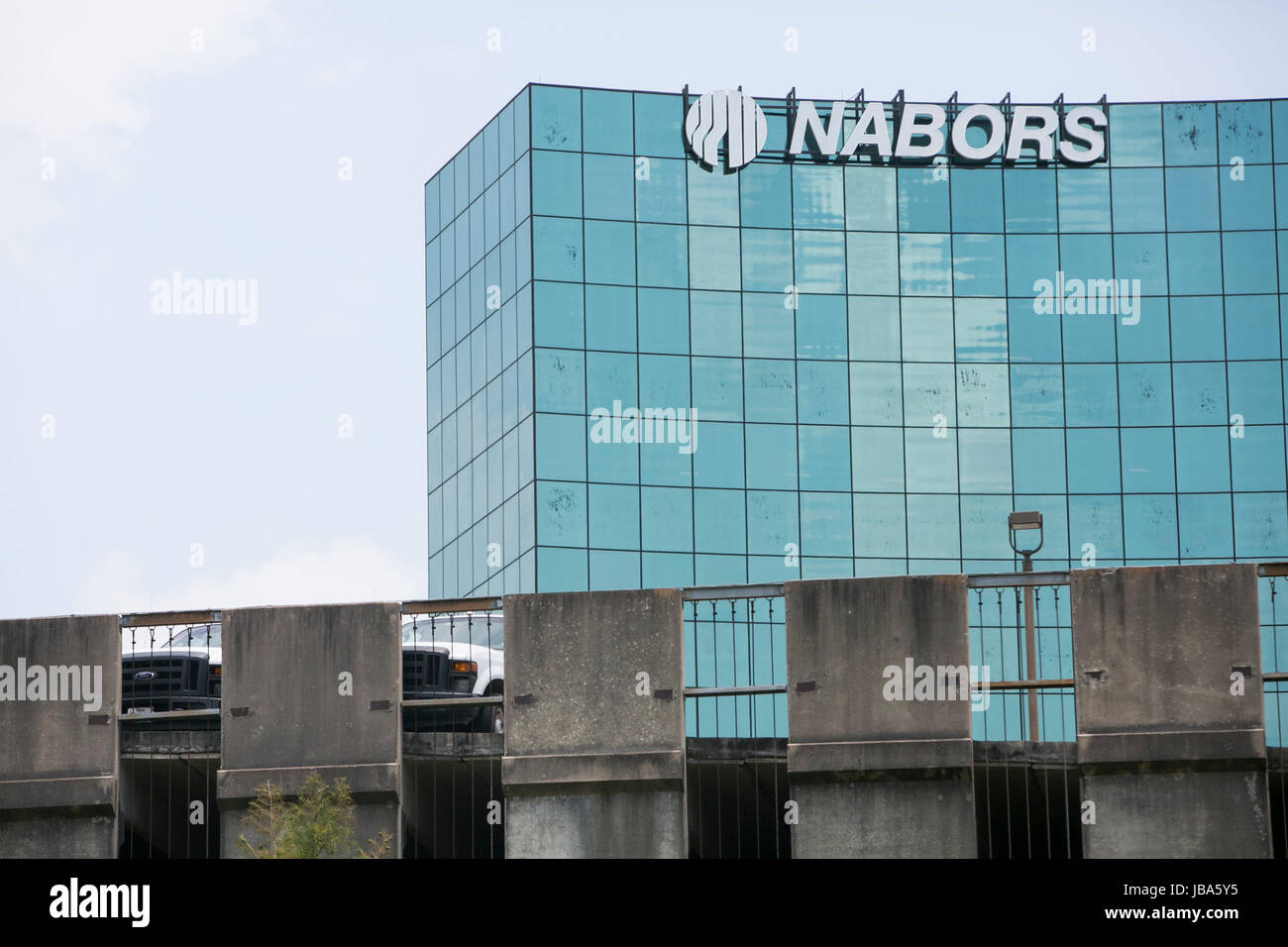 A logo sign outside of a facility occupied by Nabors Industries Ltd, in