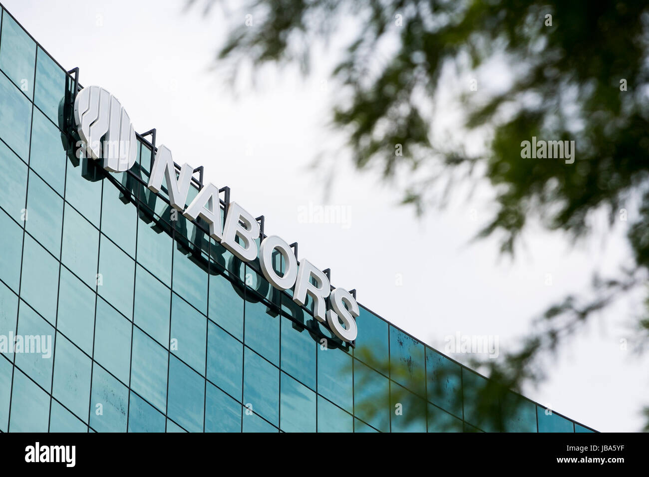 A logo sign outside of a facility occupied by Nabors Industries Ltd, in
