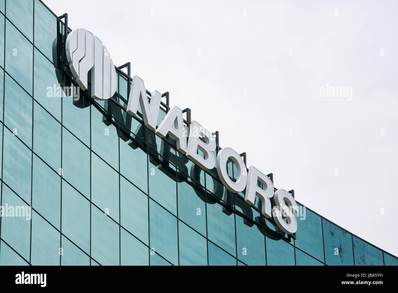 A logo sign outside of a facility occupied by Nabors Industries Ltd, in