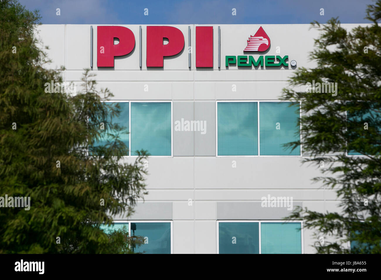 A logo sign outside of a facility occupied by PEMEX Procurement ...
