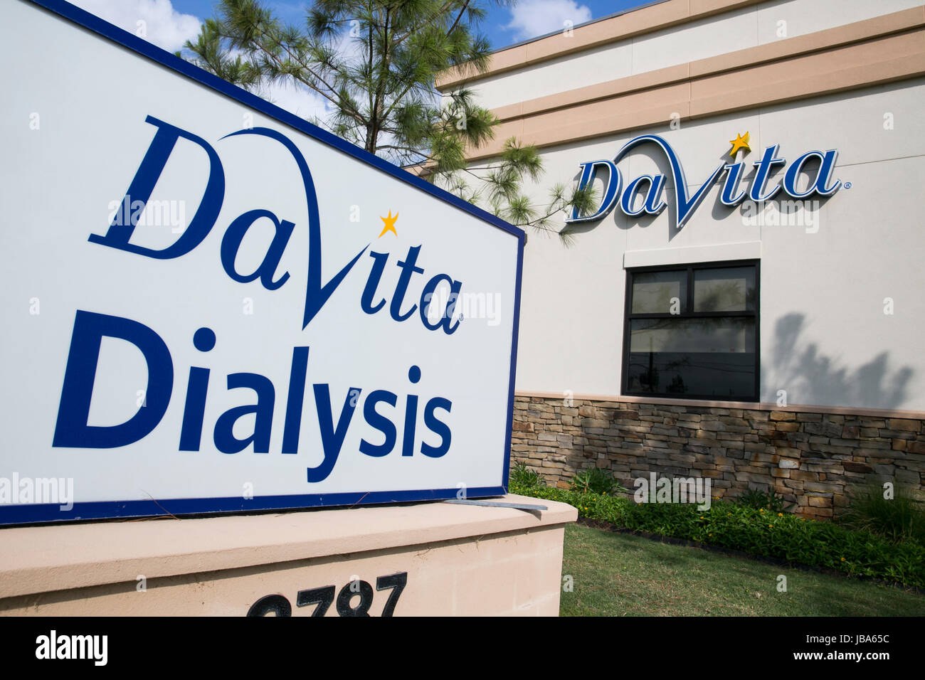 A logo sign outside of a facility occupied by DaVita Dialysis in