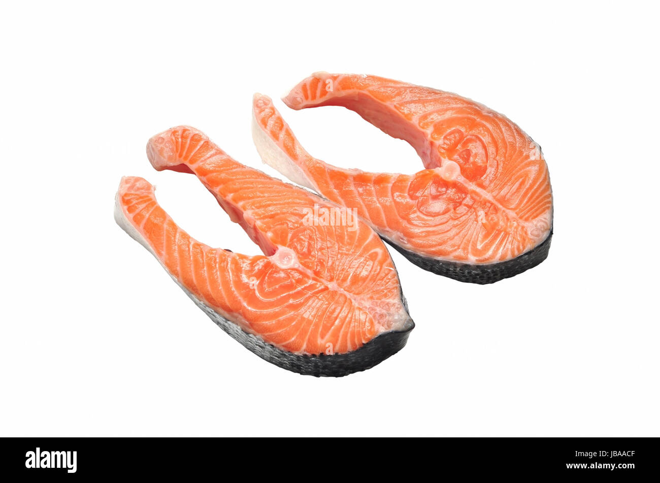 two salmon raw slice isolated on white background Stock Photo - Alamy