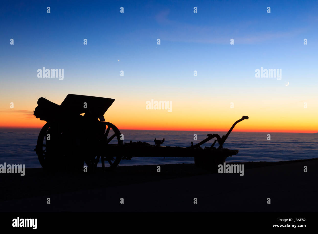 Cannon silhouette at twilight. Night landscape from Italian Alps. Stock Photo