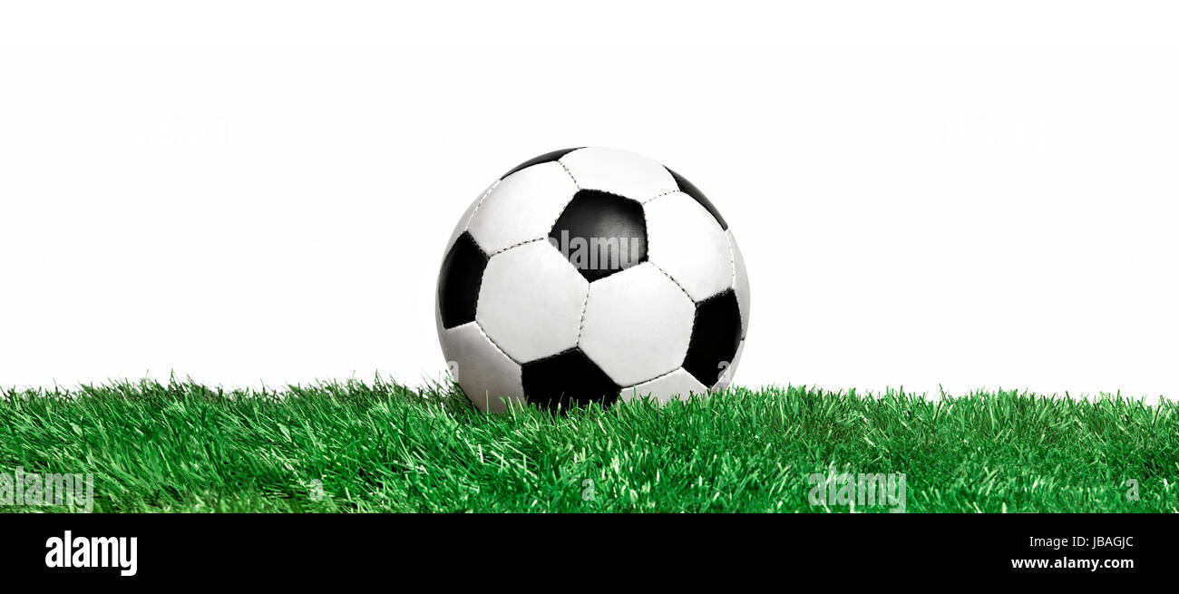 Classic soccer ball on field grass Stock Photo