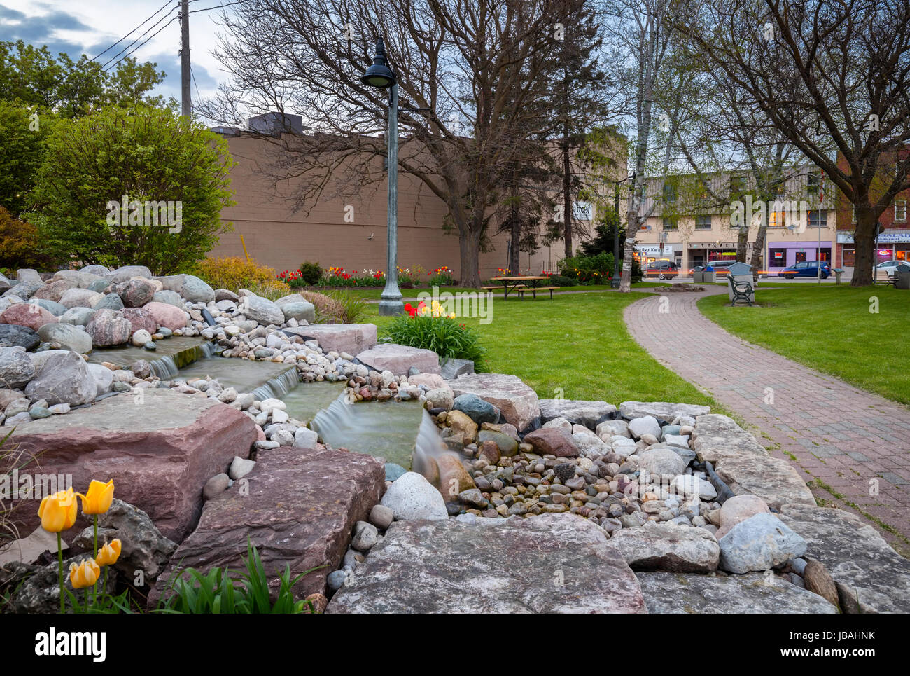 A small waterfall at Dewan Park in downtown Ingersoll, Oxford County, Ontario, Canada. Stock Photo