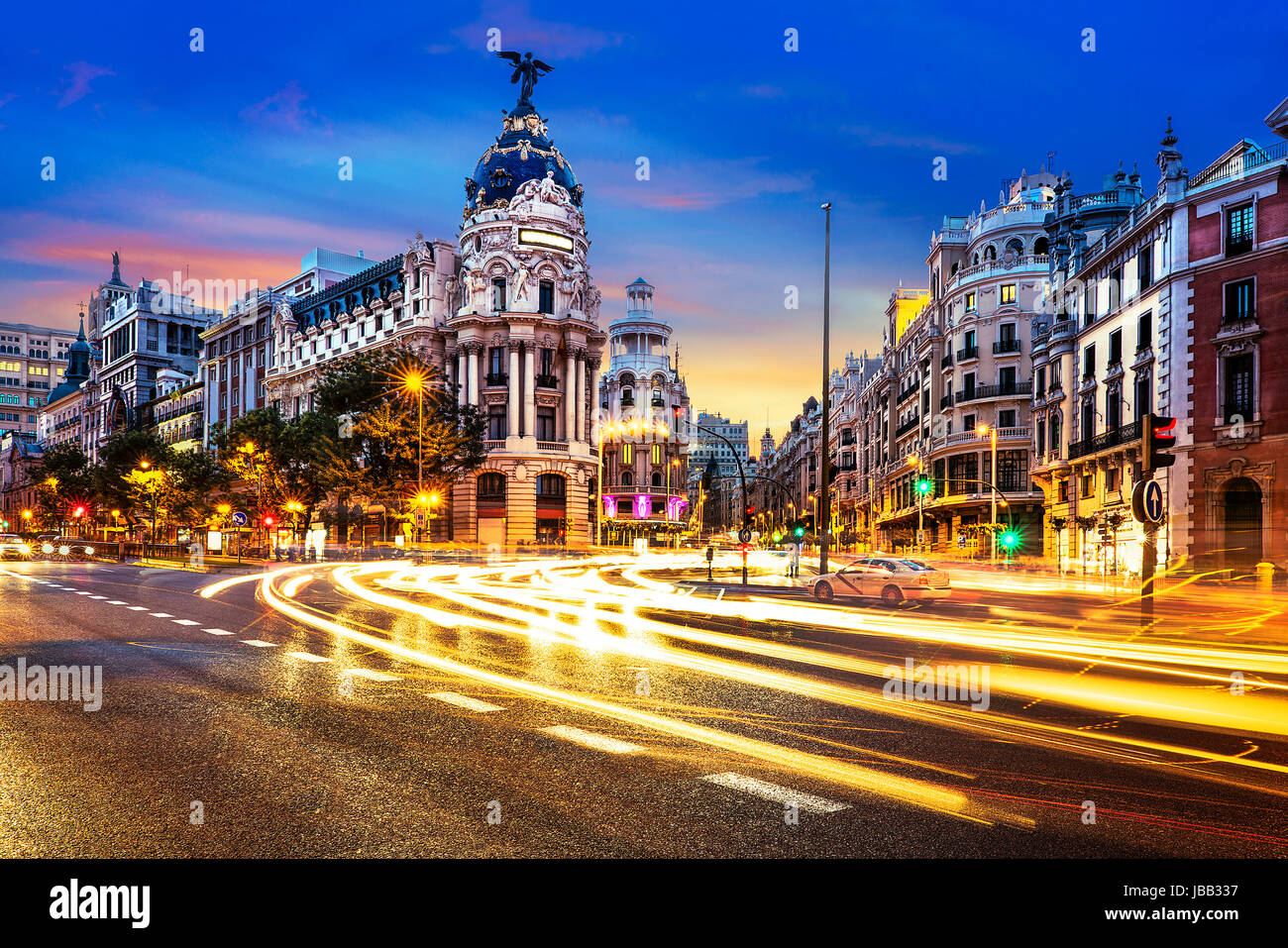 Rays of traffic lights on Gran via street, main shopping street in Madrid at night. Spain, Europe. Stock Photo