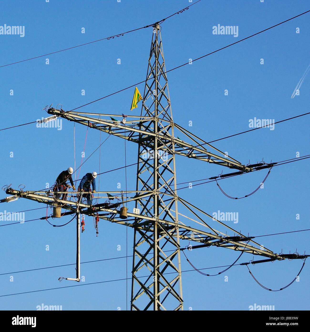 maintenance on high-voltage mast Stock Photo
