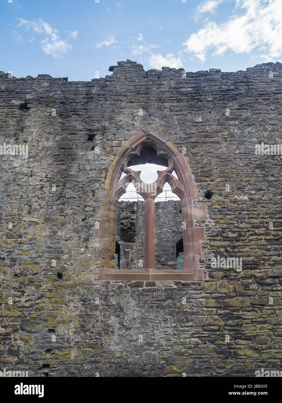 Window in one of the inside walls of massive Conwy Castle in Wales built by king Edward I as one of the fortifications during the conquest of Wales in the 13th Century Stock Photo