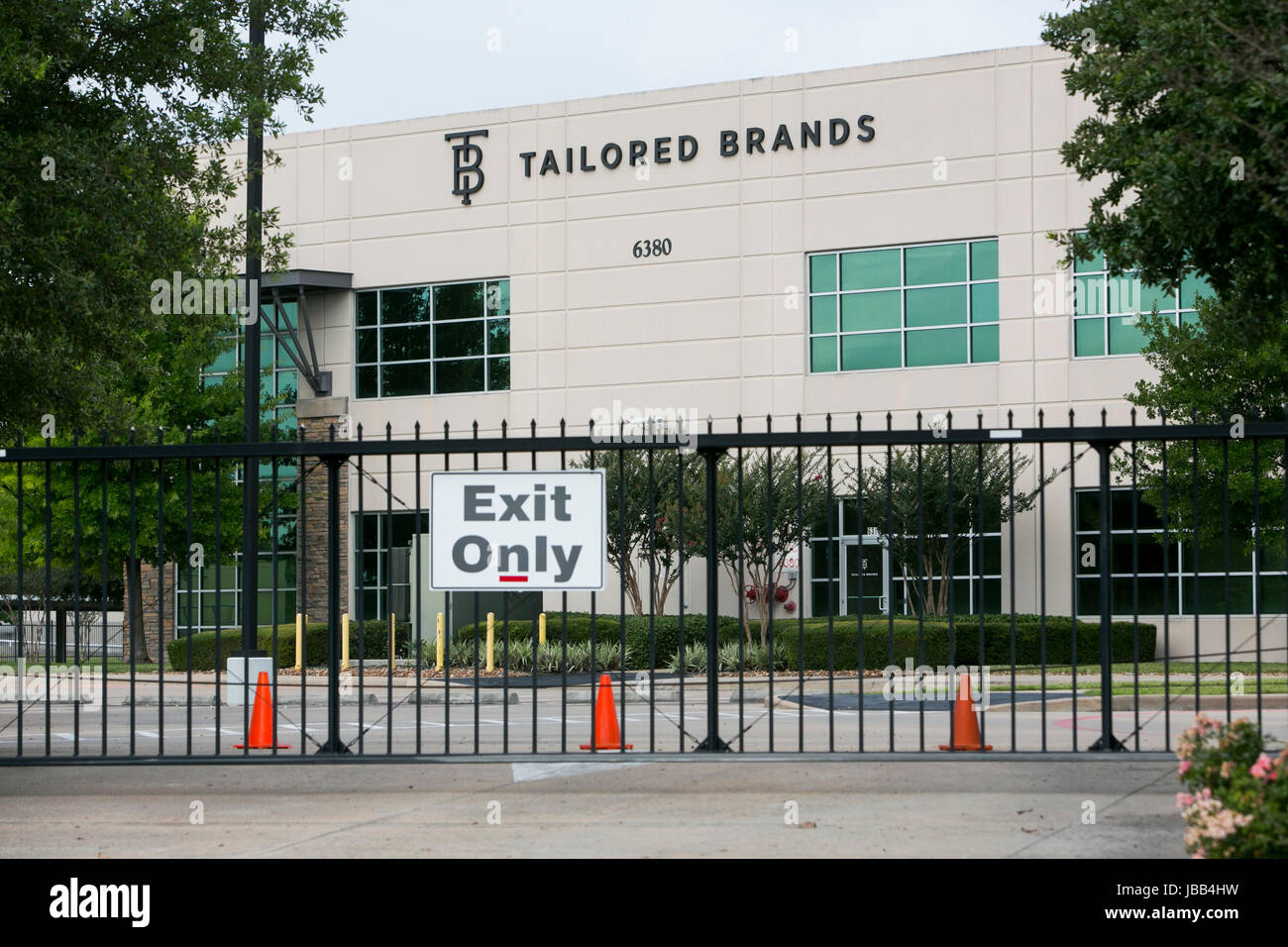 A logo sign outside of the headquarters of Tailored Brands, Inc., the parent company of Men's Wearhouse and JoS. A. Bank Clothiers, in Houston, Texas, Stock Photo