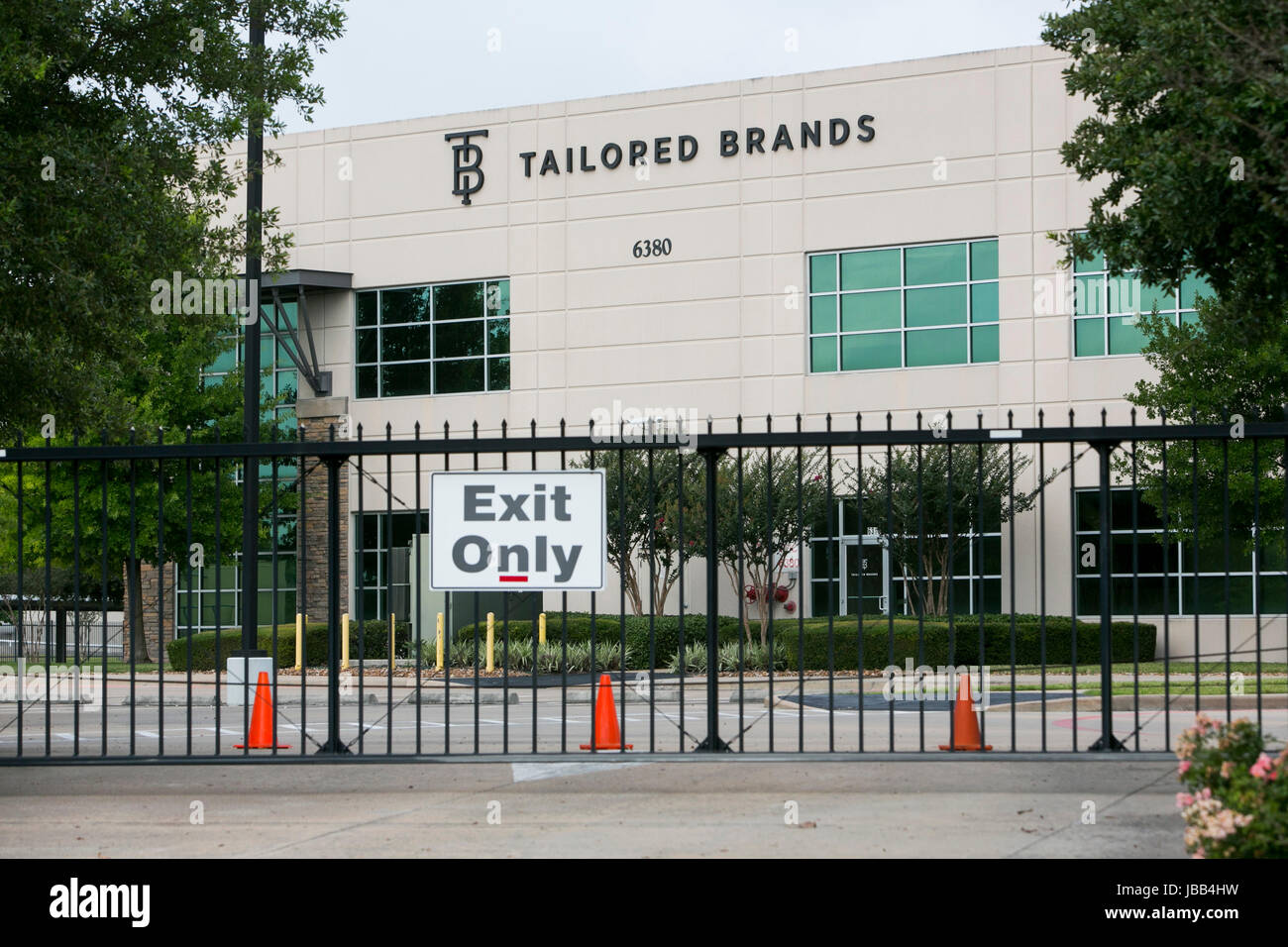 A logo sign outside of the headquarters of Tailored Brands, Inc., the