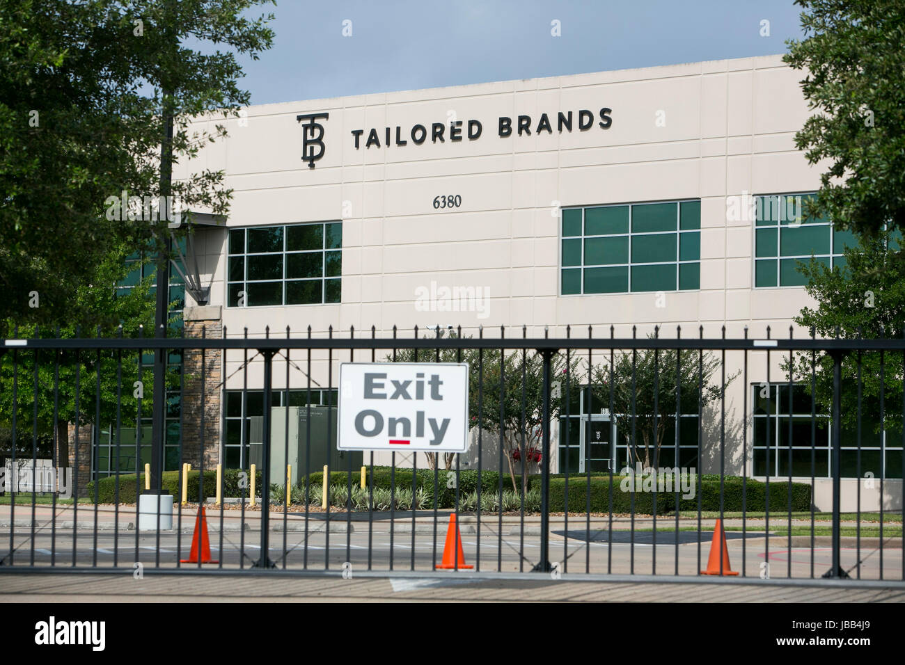 A logo sign outside of the headquarters of Tailored Brands, Inc., the parent company of Men's Wearhouse and JoS. A. Bank Clothiers, in Houston, Texas, Stock Photo